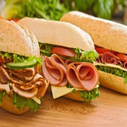 three deli sandwiches